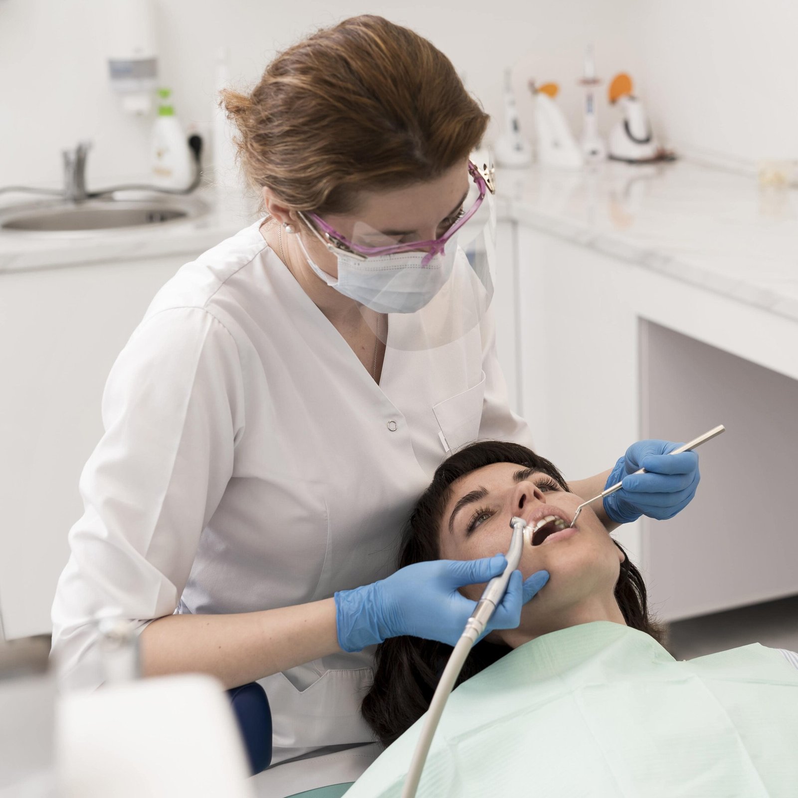 female-patient-having-procedure-done-dentist(1)-min
